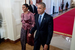 President Barack Obama and first lady Michelle Obama, left, arrive for a Presidential Medal of Freedom ceremony in the East Room of the White House, Tuesday, Nov. 22, 2016, in Washington. Obama is recognizing 21 Americans with the nation's highest civilian award, including giants of the entertainment industry, sports legends, activists and innovators. (AP Photo/Andrew Harnik)
