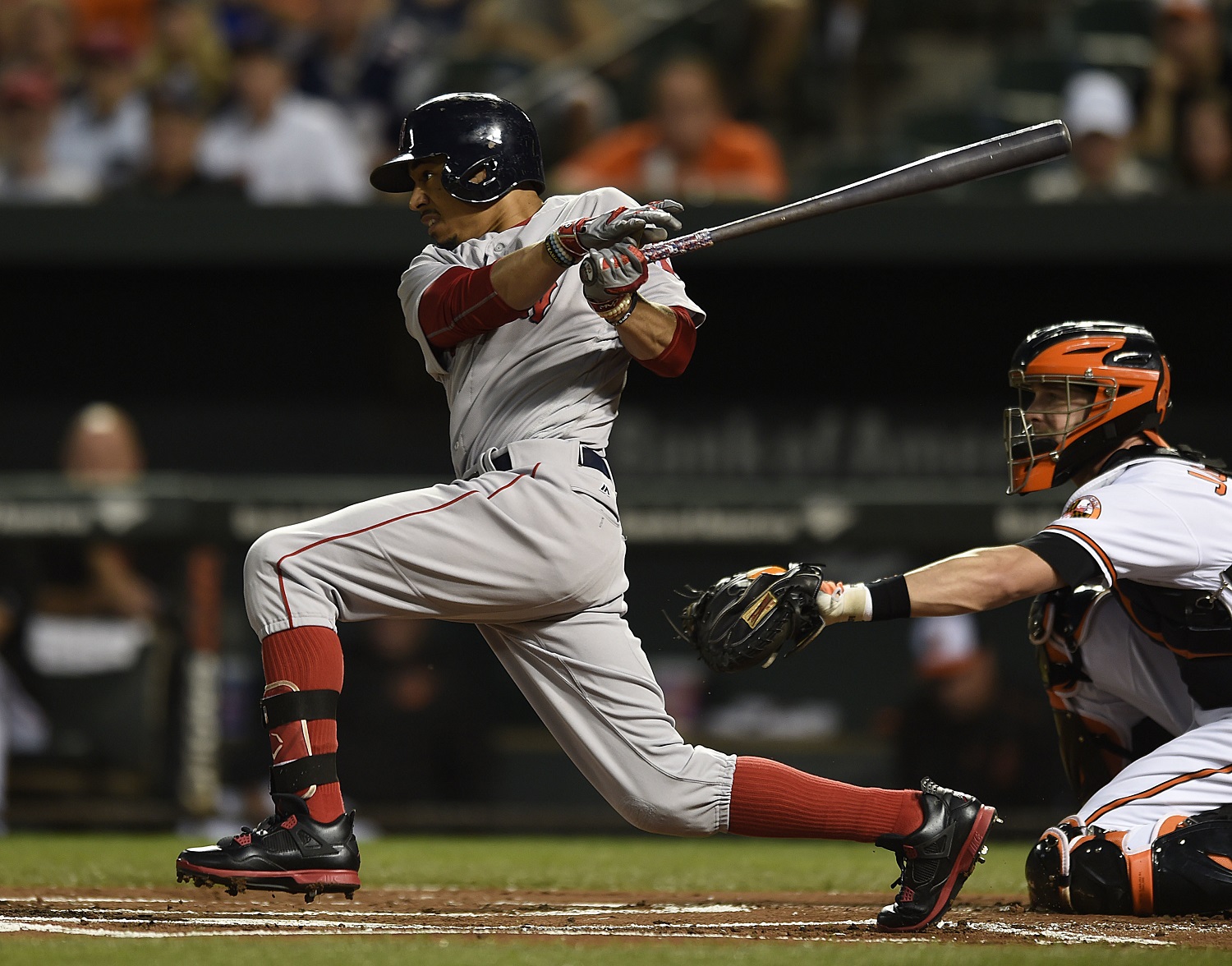Boston Red Sox Mookie Betts follows through on a single against the Baltimore Orioles in the first inning of a baseball game, Thursday, Sept. 22, 2016, in Baltimore. (AP Photo/Gail Burton)