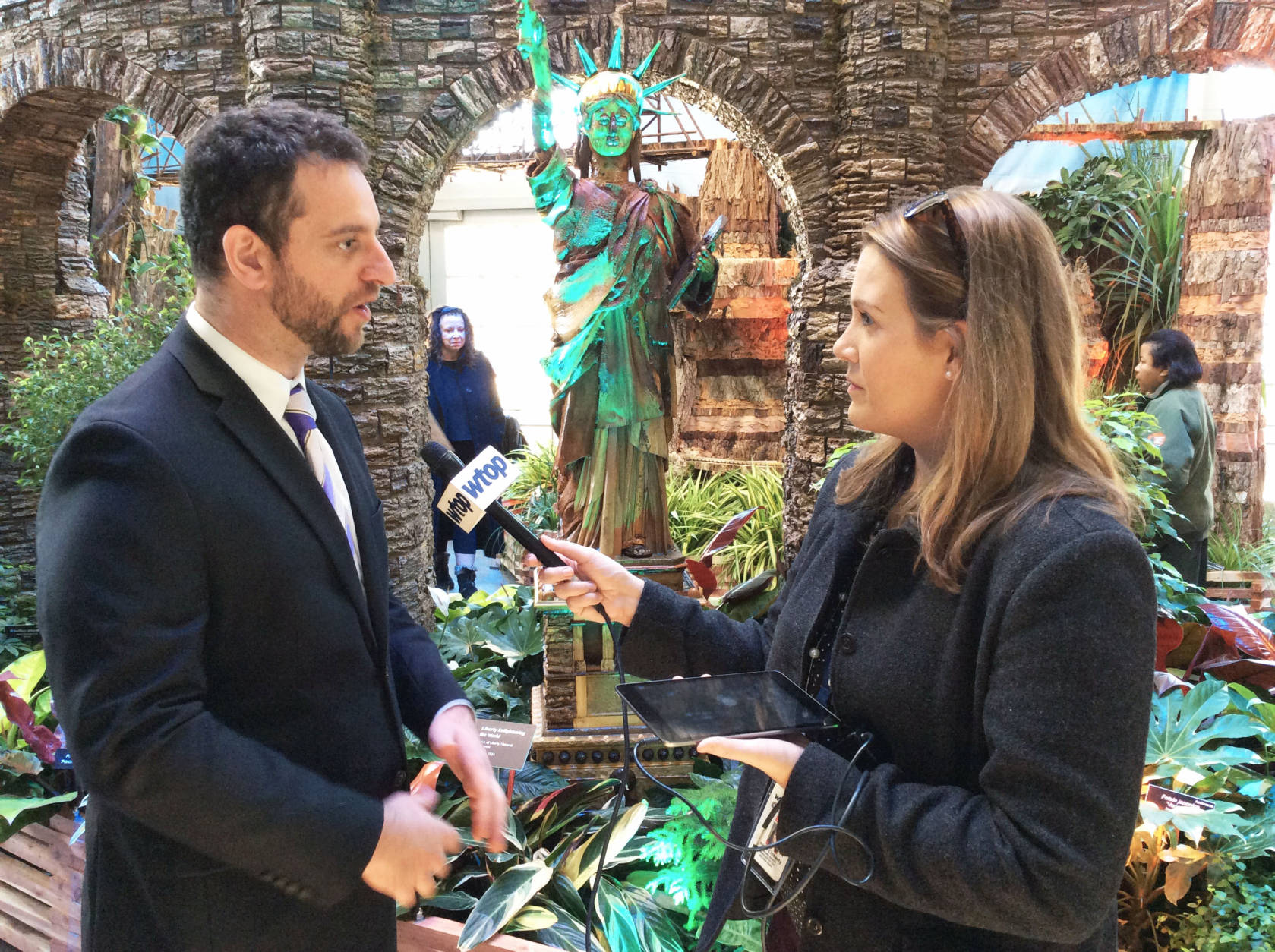 WTOP's Megan Cloherty visited the garden to interview the people behind the  scenes of the special holiday exhibit. (WTOP/Hanna Choi)
