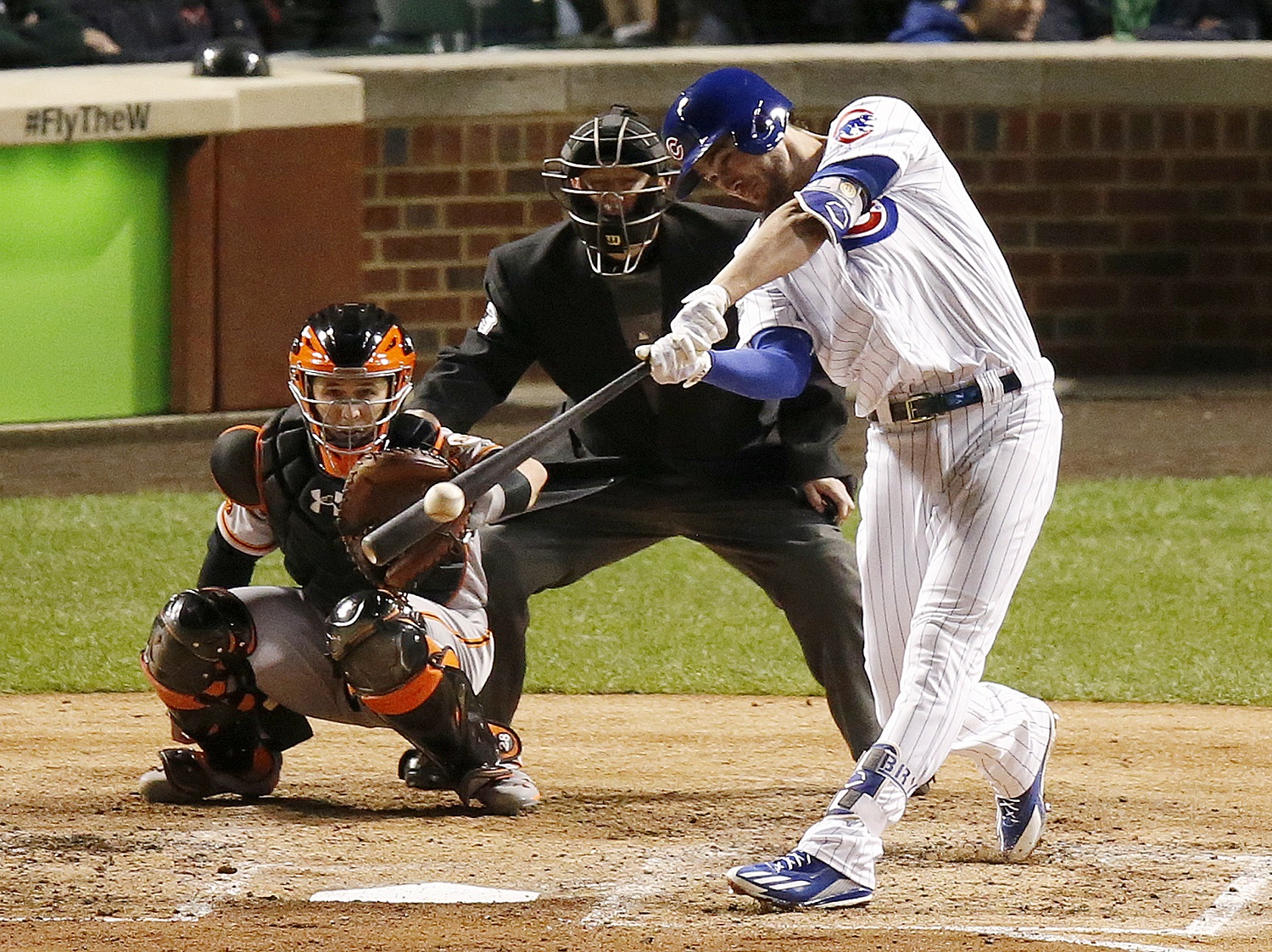 Chicago Cubs' Kris Bryant hits a double in the fourth inning of Game 1 of baseball's National League Division Series against the San Francisco Giants, Friday, Oct. 7, 2016, in Chicago. (AP Photo/Charles Rex Arbogast)