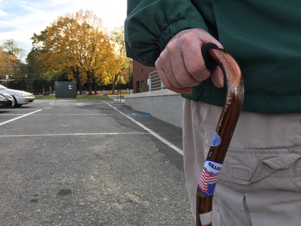 Rayburn Hess said he'd like use his "I Voted" cane over the heads of politicians, WTOP's Kristi King reports. (WTOP/Kristi King)