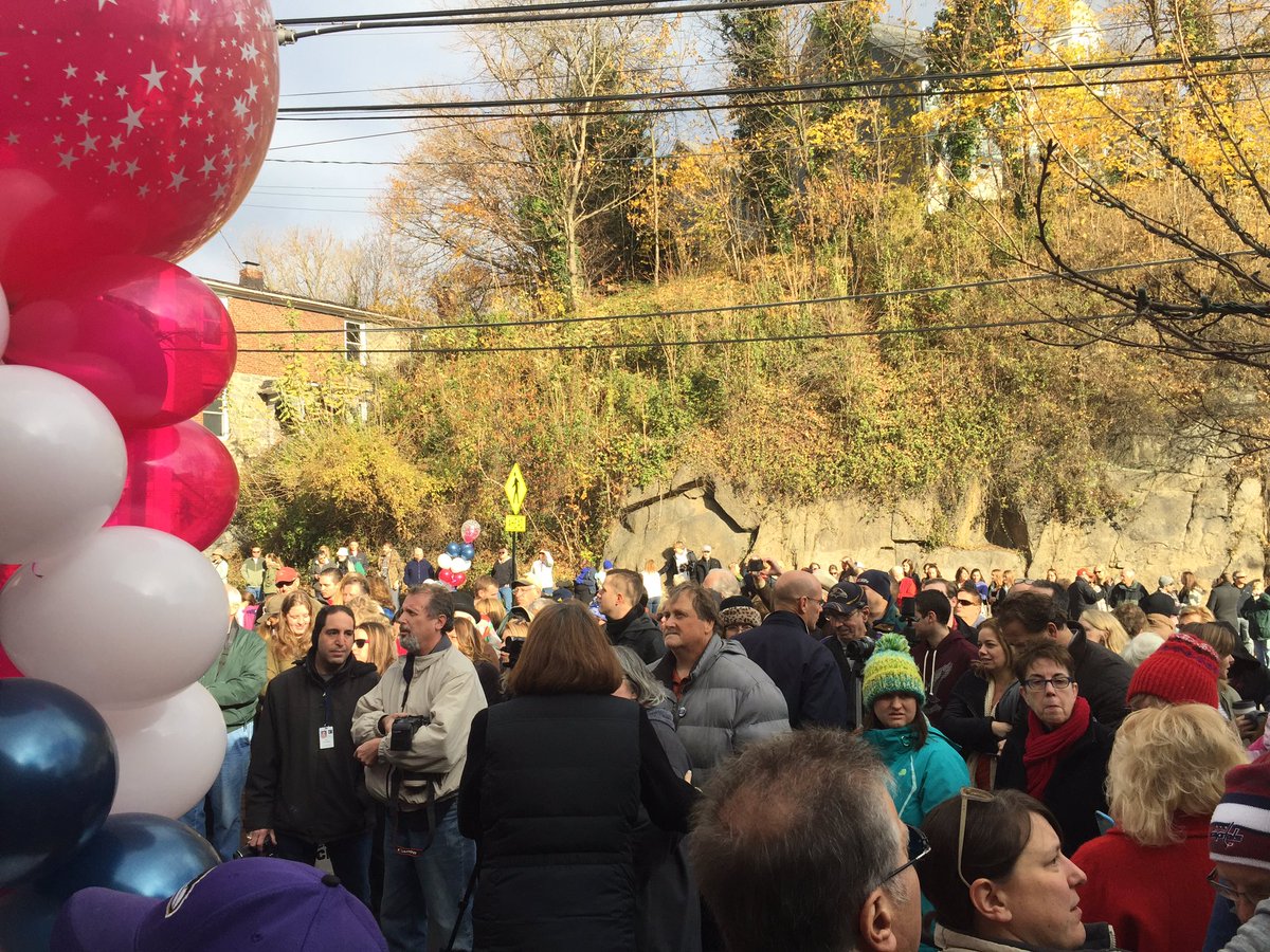 Crowds gather on Main Street in Ellicott City for Small Business Saturday on Saturday, Nov. 26, 2016, which was marked by a ribbon cutting ceremony officially "reopening" Main Street after July’s deadly flood. (WTOP/John Domen)