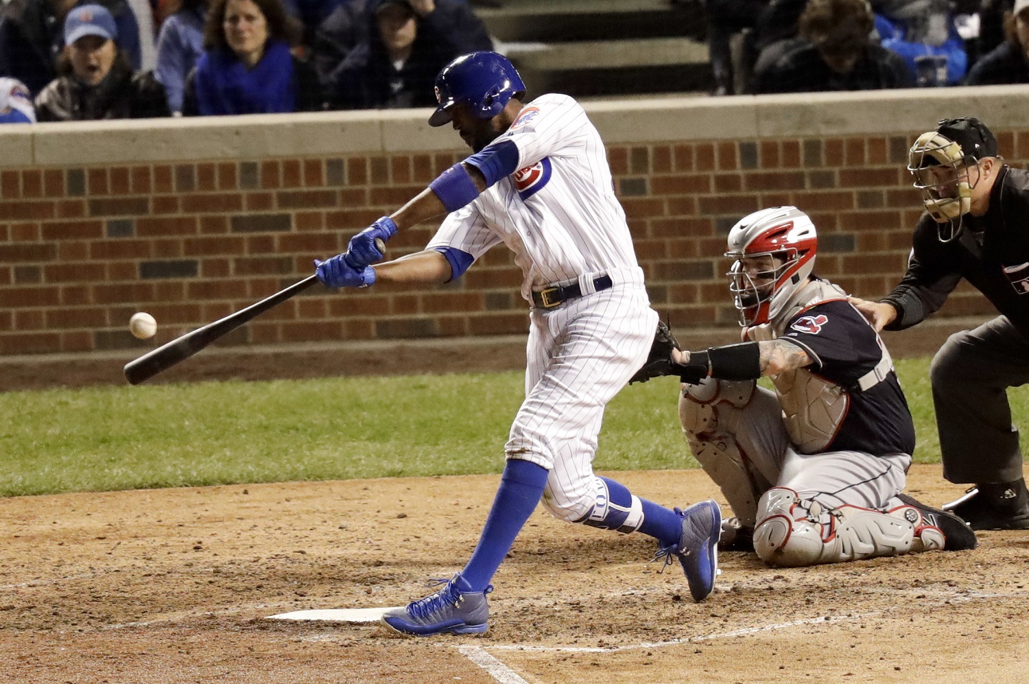 Chicago Cubs' Dexter Fowler hits a home run against the Cleveland Indians during the eighth inning of Game 4 of the Major League Baseball World Series Saturday, Oct. 29, 2016, in Chicago. (AP Photo/Charles Rex Arbogast)