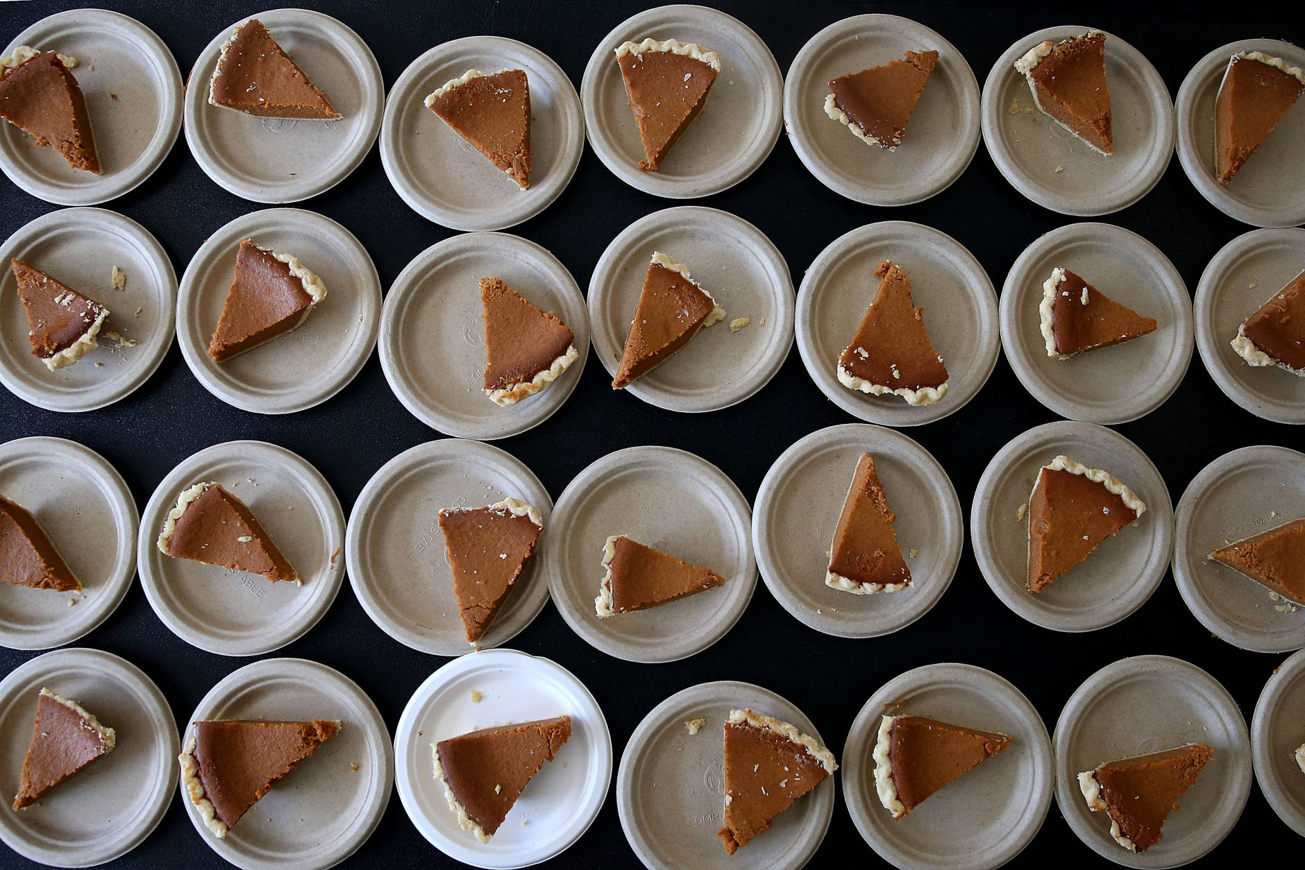 RICHMOND, CA - NOVEMBER 25:  Slices of pumpkin pie sit on a table during the Great Thanksgiving Banquet hosted by the Bay Area Rescue Mission on November 25, 2015 in Richmond, California. Hundreds of homeless and needy people were given a free meal a day before Thanksgiving.  (Photo by Justin Sullivan/Getty Images)