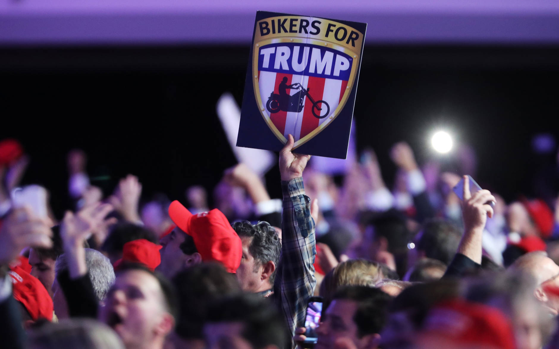 NEW YORK, NY - NOVEMBER 08:  An attendee holds up a sign in support of Republican presidential nominee Donald Trump that reads "Bikers For Trump" during the election night event at the New York Hilton Midtown on November 8, 2016 in New York City. Americans today will choose between Republican presidential nominee Donald Trump and Democratic presidential nominee Hillary Clinton as they go to the polls to vote for the next president of the United States.  (Photo by Spencer Platt/Getty Images)