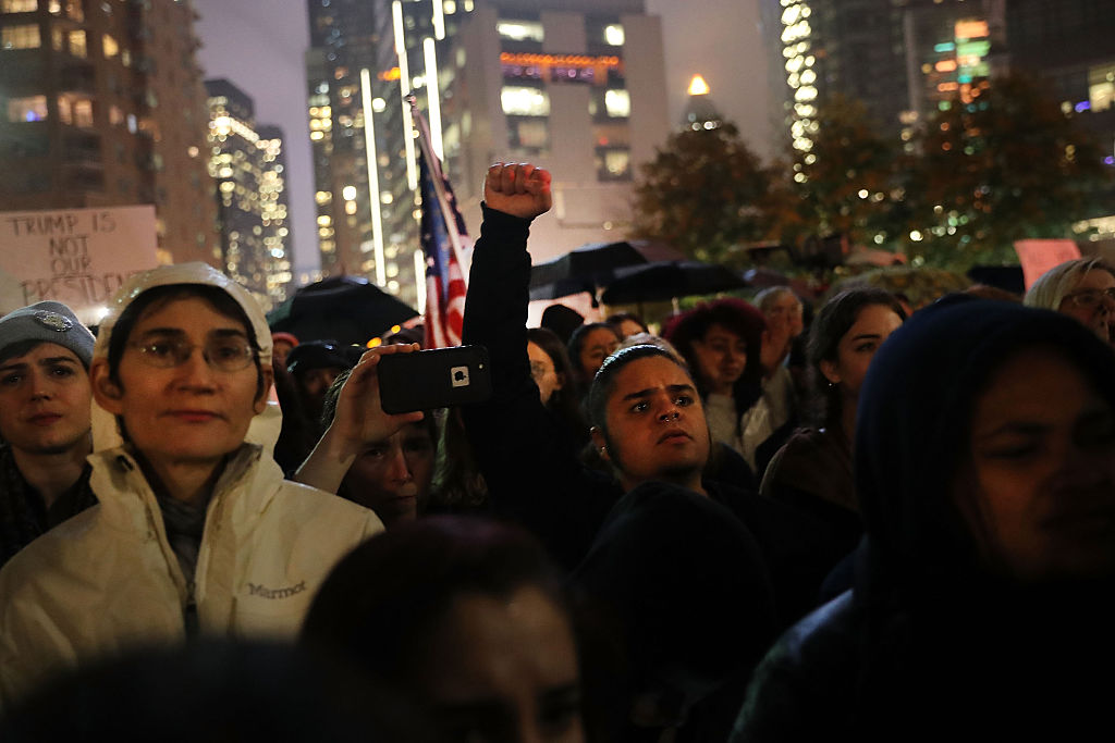 NEW YORK, NY - NOVEMBER 09:  Anti-Trump protesters gather in a park as New Yorkers react to the election of Donald Trump as president of the United States on November 9, 2016 in New York City. Trump defeated Democrat Hillary Clinton in an upset to become the 45th president.  (Photo by Spencer Platt/Getty Images)