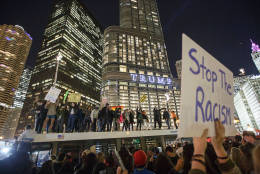 CHICAGO, IL - NOVEMBER 09: Demonstrators protest on top of a bus outside of the Trump Tower November 9, 2016 in Chicago, Illinois. Thousands of people across the United States took to the streets in protest a day after Republican Donald Trump was elected president, defeating Democrat Hillary Clinton. (Photo by John Gress/Getty Images)