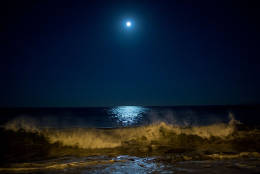 Surf breaks as the moon makes its closest orbit to the Earth since 1948 on November 14, 2016 in Redondo Beach, California. The so-called supermoon appears up to 14 percent bigger and 30 percent brighter as it comes about 22,000 miles closer to the Earth than average, though to the casual observer, the increase appears slight.   (Photo by David McNew/Getty Images)