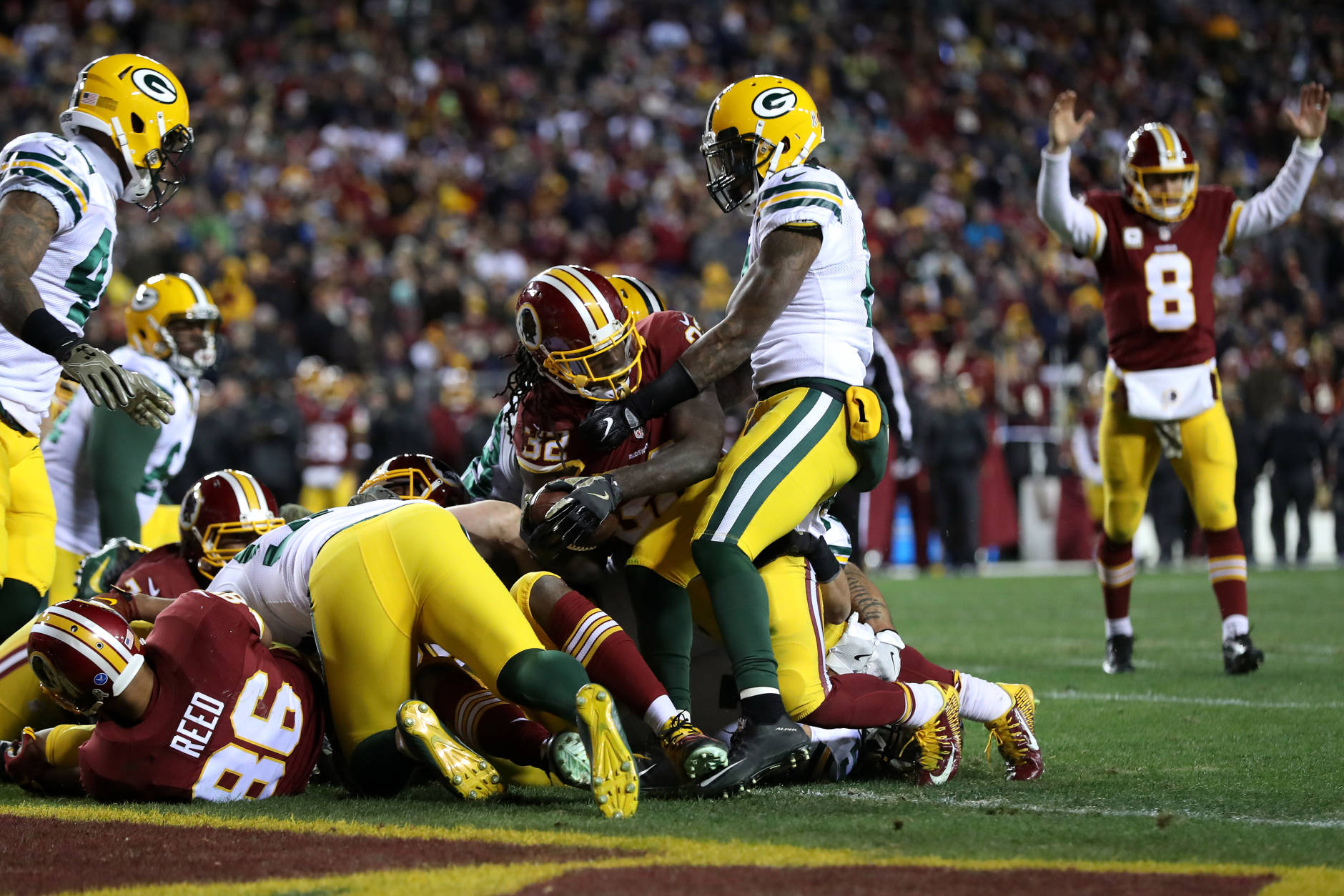 LANDOVER, MD - NOVEMBER 20: Running back Rob Kelley #32 of the Washington Redskins scores a fourth quarter touchdown while teammate quarterback Kirk Cousins #8 celebrates against the Green Bay Packers at FedExField on November 20, 2016 in Landover, Maryland. (Photo by Rob Carr/Getty Images)