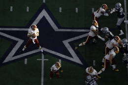 ARLINGTON, TX - NOVEMBER 24:   Kirk Cousins #8 of the Washington Redskins drops back to pass during the first half against the Dallas Cowboys at AT&amp;T Stadium on November 24, 2016 in Arlington, Texas.  (Photo by Ronald Martinez/Getty Images)