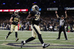 NEW ORLEANS, LA - NOVEMBER 27: Tim Hightower #34 of the New Orleans Saints scores a touchdown during the second half of a game against the Los Angeles Rams at the Mercedes-Benz Superdome on November 27, 2016 in New Orleans, Louisiana.  (Photo by Sean Gardner/Getty Images)