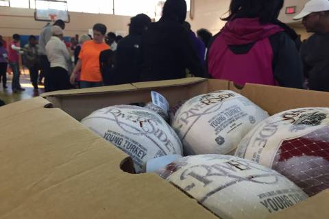 Volunteers pack and deliver Thanksgiving meals to those in need