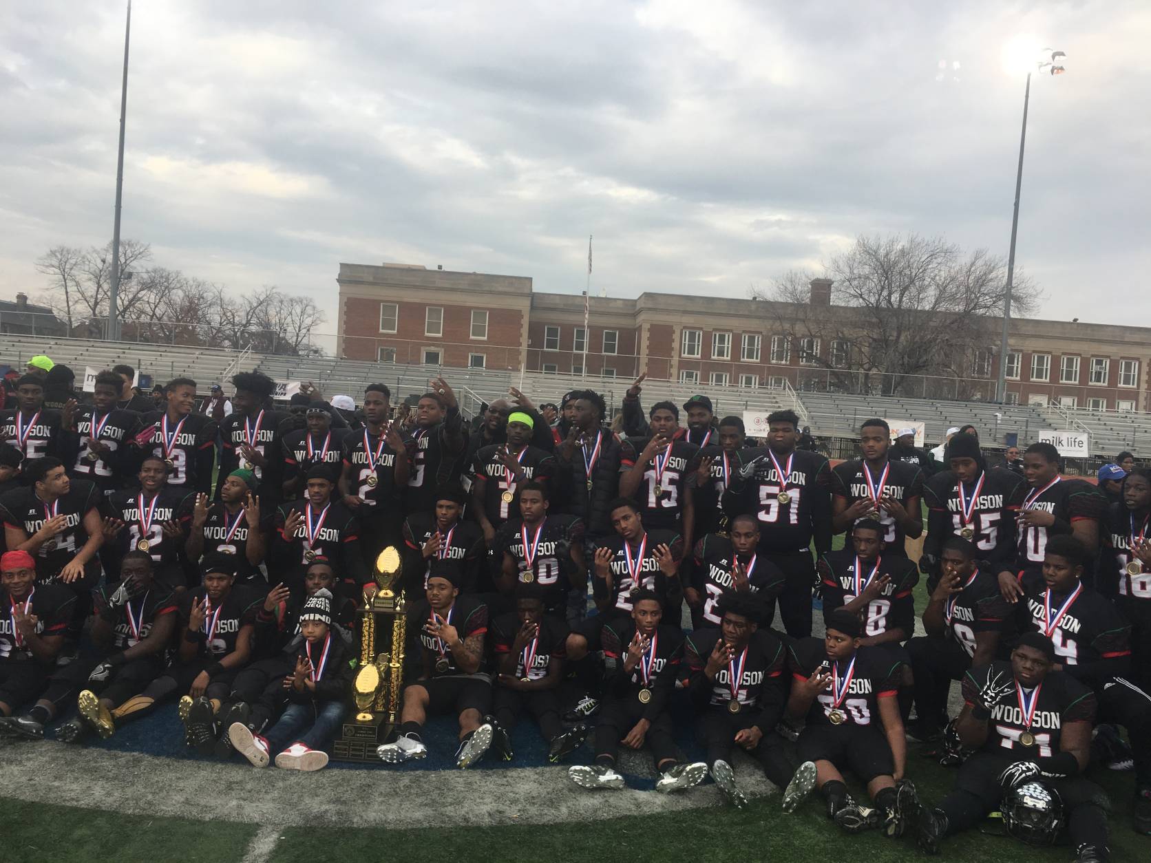 H.D. Woodson High School celebrates after winning the Turkey Bowl Thursday, Nov. 24, 2016. (WTOP/Mike Murillo)