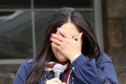 Claudia Avila cries during a ceremony where she and her husband received a smart home Friday, Nov. 11, 2016. (WTOP/Kate Ryan)