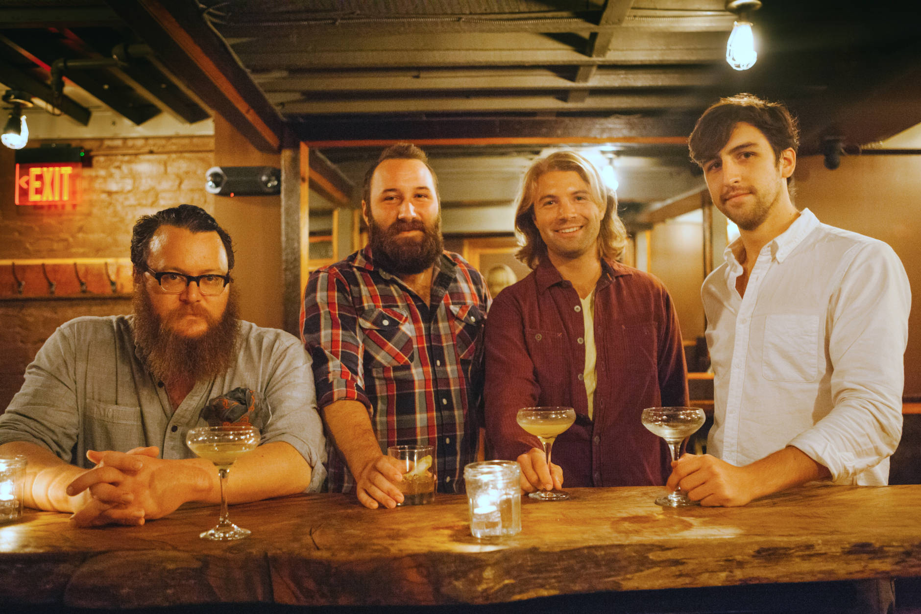 Bar manager Lukas Smith and distiller Chas Jefferson with Cotton & Reed co-founders Reed Walker and Jordan Cotton. (Courtesy Cotton & Reed)