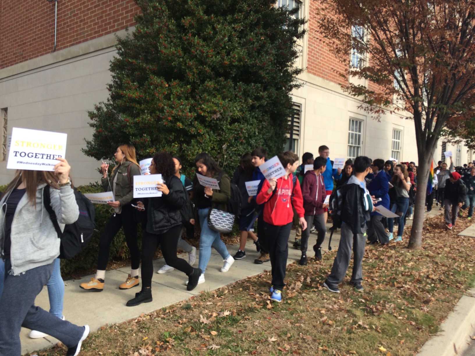 Students from Richard Montgomery High School, in Rockville, march in protest of the election of Donald Trump to the presidency Wednesday morning. A 15-year-old in a 'Make America Great Again' hat was beaten during the march. (WTOP/Nick Iannelli)