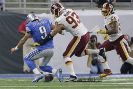 Detroit Lions quarterback Matthew Stafford (9) fumbles the ball while pressured by Washington Redskins defensive end Trent Murphy (93) during the second half of an NFL football game, Sunday, Oct. 23, 2016 in Detroit. (AP Photo/Duane Burleson)