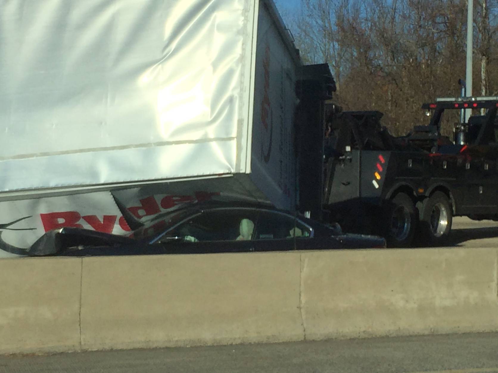 A truck crashed on top of two cars on the Outer Loop of the Capital Beltway near the American Legion Bridge on Nov. 23, 2016. (District Rising via Twitter)