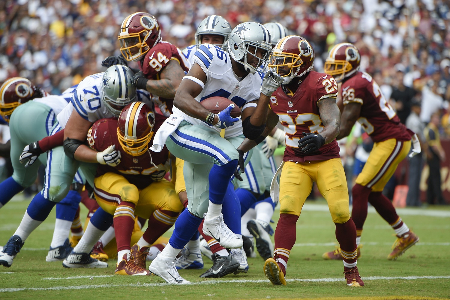 Dallas Cowboys running back Albert Morris (46) carries the ball into the end zone for a touchdown past Washington Redskins free safety DeAngelo Hall (23) during the second half of an NFL football game in Landover, Md., Sunday, Sept. 18, 2016. (AP Photo/Nick Wass)