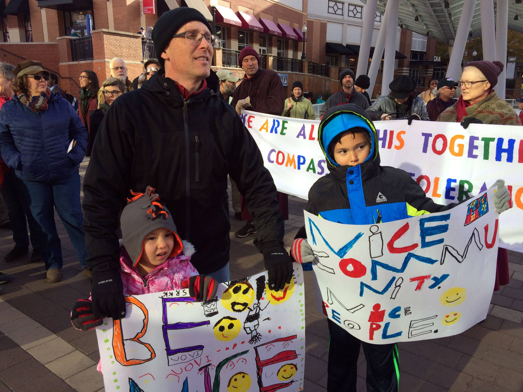 Korey Hartwich and children, Sanae, 5, and Rowan, 8, participate in an interfaith rally in Silver Spring, Md. on Sunday,  Nov. 20, 2016. (WTOP/Dick Uliano)