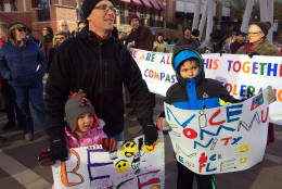 Korey Hartwich and children, Sanae, 5, and Rowan, 8, participate in an interfaith rally in Silver Spring, Md. on Sunday,  Nov. 20, 2016. (WTOP/Dick Uliano)