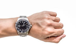 A man hand with Watch on wrist isolated over a white background