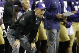 FILE - In this Sept. 30, 2016, file photo, Washington coach Chris Petersen yells from the sideline during the second half of the team's NCAA college football game against Stanford, in Seattle, Wash. After nearly a decade of dominance, Oregon is limping into Saturday's rivalry game in Eugene, Ore., against the No. 5 Huskies with a 3-game losing streak, while Washington is rising in its second year under coach Petersen.(AP Photo/Ted S. Warren, File)