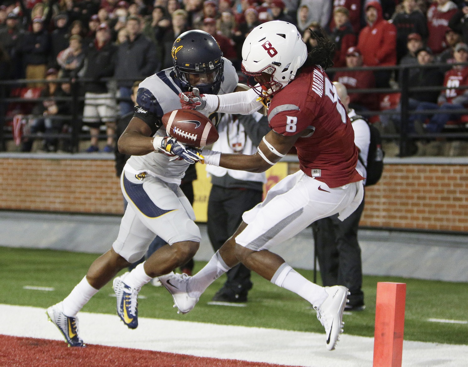 California cornerback Josh Drayden, left, breaks up a pass intended for Washington State wide receiver Tavares Martin Jr. (8) during the first half of an NCAA college football game in Pullman, Wash., Saturday, Nov. 12, 2016. (AP Photo/Young Kwak)