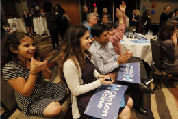 Izzy Agarawal, from left, with her sister Cathy, father, Raj and brother Ben, right, celebrate as they watch returns during the Dallas County Democrats watch party, Tuesday Nov. 8, 2016, in Dallas. (AP Photo/Tony Gutierrez)
