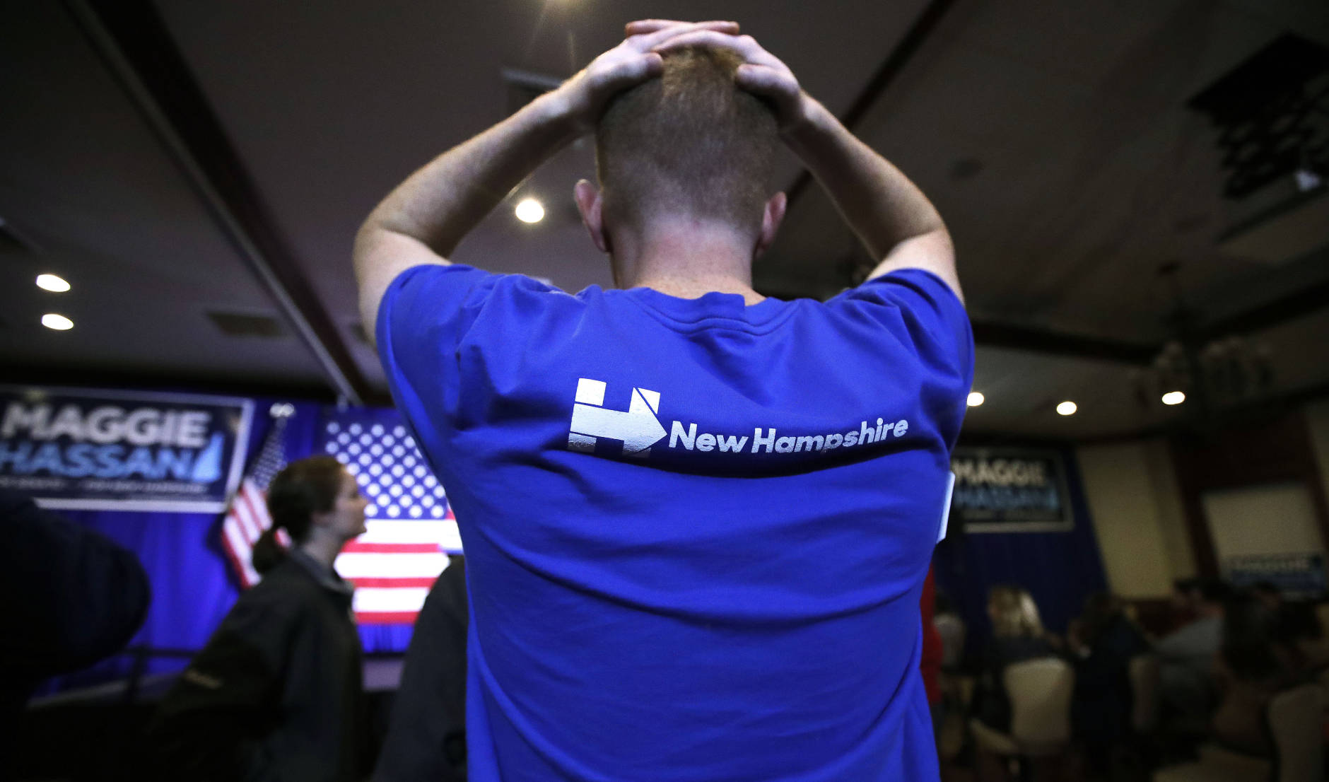 Matt Sanborn of Laconia, N.H., a Boston College student who volunteered for Democratic candidates including Hillary Clinton and New Hampshire Democratic Senate candidate, Gov. Maggie Hassan, rests his hands on the top of his head while watching election returns during an election night rally in Manchester, N.H., Tuesday, Nov. 8, 2016. (AP Photo/Charles Krupa)