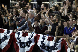 Supporters cheer as they watch election returns during Democratic presidential nominee Hillary Clinton's election night rally in the Jacob Javits Center glass enclosed lobby in New York, Tuesday, Nov. 8, 2016. (AP Photo/David Goldman)