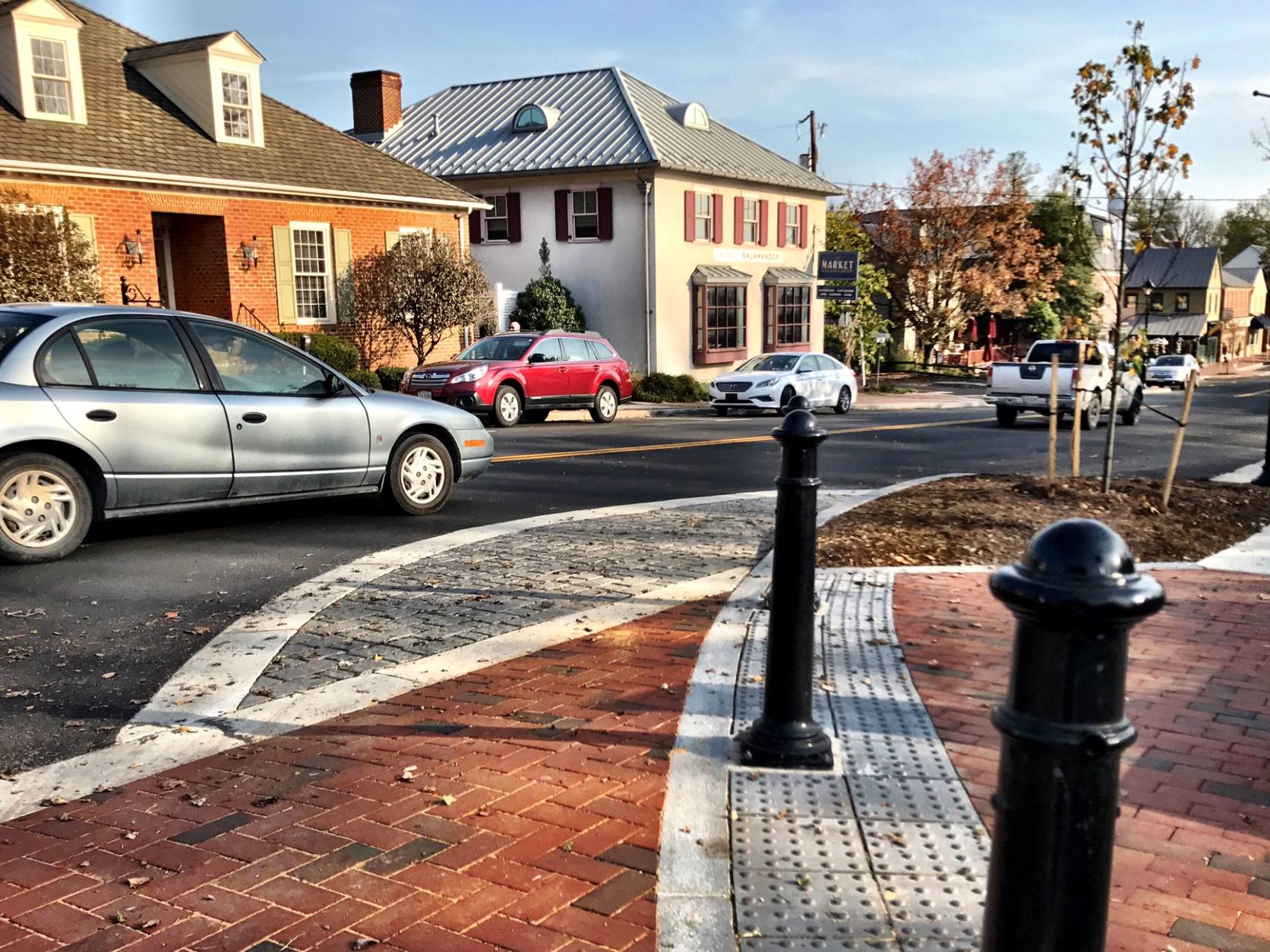 The $4.2 million project uses subtle design features to minimize speeds through the pedestrian zone, including crosswalks made of bricks, rather than the asphalt used on Washington Street. (WTOP/Neal Augenstein)