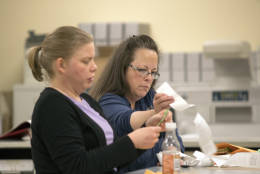 Rowan County Clerk Kim Davis, right, and County Democratic election representative Kathryn Reeder, count votes at the county courthouse Tuesday, November 8, 2016 in Morehead, Ky. Davis is the Kentucky clerk who was jailed for refusing to issue marriage licenses to gay couples.  (AP Photo/John Flavell)