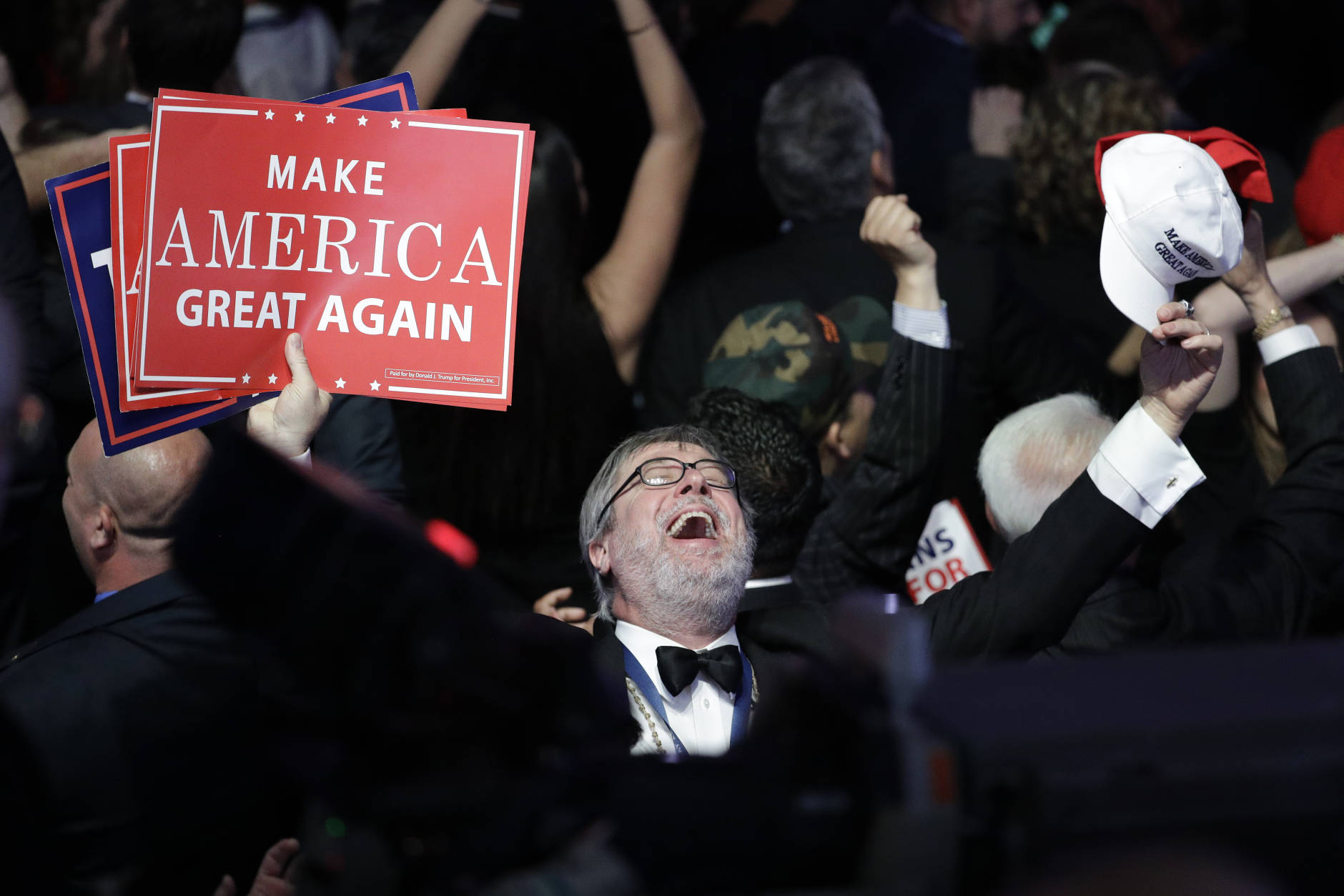 Supporters of Republican presidential candidate Donald Trump react as they watch the election results during Trump's election night rally, Tuesday, Nov. 8, 2016, in New York. (AP Photo/John Locher)
