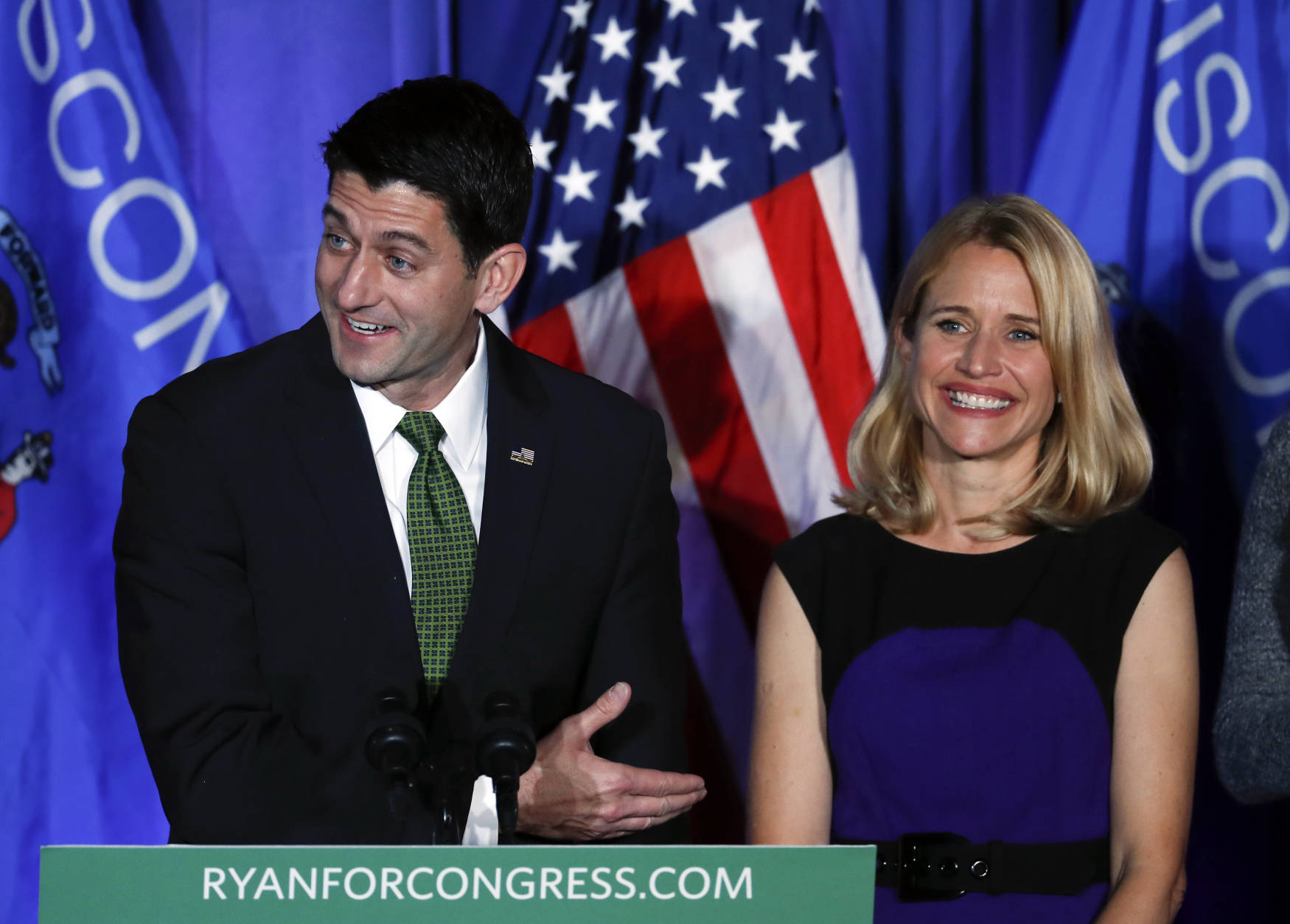 House Speaker Paul Ryan of Wisconsin smiles with his wife Janna at a campaign rally in Janesville, Wis., Tuesday, Nov. 8, 2016. (AP Photo/Paul Sancya)