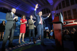 Sen. Rob Portman, R-Ohio, center, celebrates with his son Jed, left, wife Jane, second from left, and son Will, center left, during an election night rally at The Vault, Tuesday, Nov. 8, 2016, in Columbus, Ohio. (AP Photo/John Minchillo)