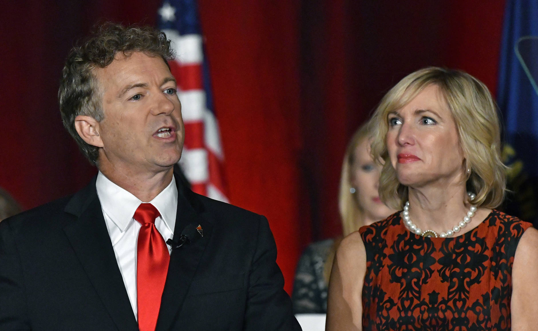 With his wile Kelley looking on, Sen. Rand Paul, R-Ky. speaks to the crowd gathered at his victory celebration, Tuesday, Nov. 8, 2016, in Louisville Ky. (AP Photo/Timothy D. Easley)