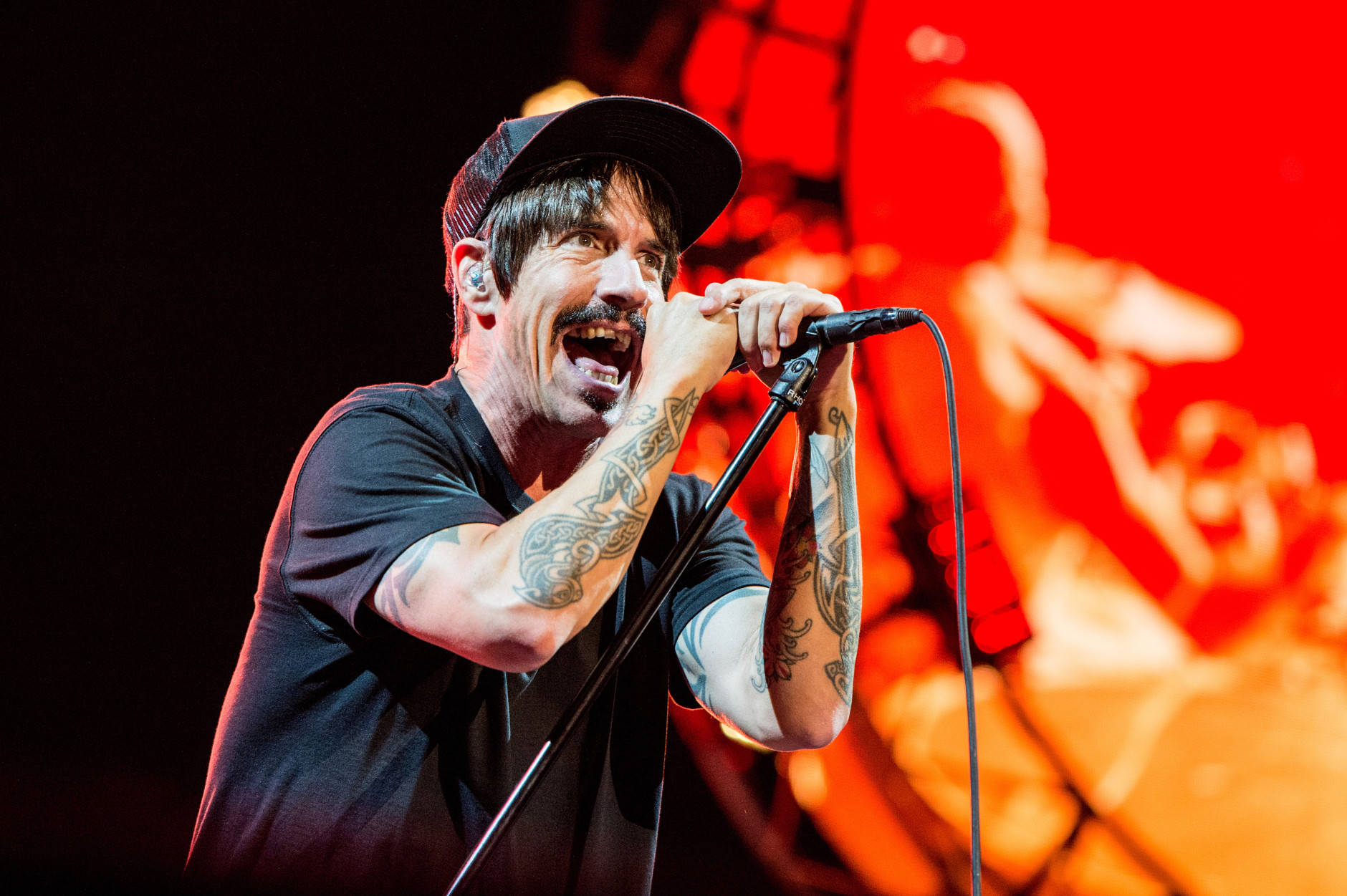 FILE - In this July 30, 2016 file photo, Anthony Kiedis of Red Hot Chili Peppers performs at Lollapalooza in Chicago. The band will perform at the Los Angeles Memorial Coliseum before the Rams take on the Seattle Seahawks. The Rams moved to Los Angeles this season since leaving for St. Louis in 1994. (Photo by Amy Harris/Invision/AP, File)