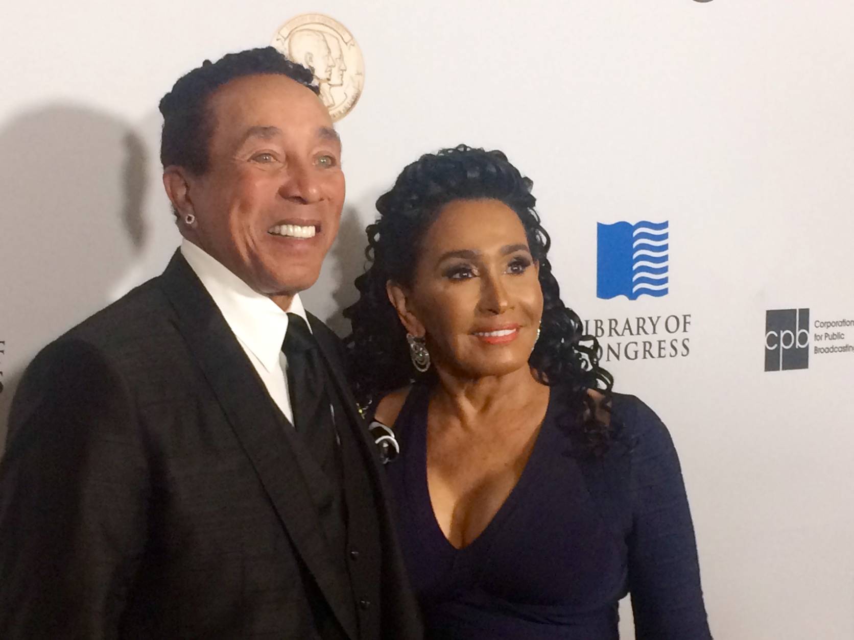 Smokey Robinson arrives on the red carpet with wife Frances Robinson to receive the Library of Congress' Gershwin Prize at DAR Constitution Hall on Wednesday night. (WTOP/Jason Fraley)