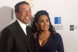 Smokey Robinson arrives on the red carpet with wife Frances Robinson to receive the Library of Congress' Gershwin Prize at DAR Constitution Hall on Wednesday night. (WTOP/Jason Fraley)
