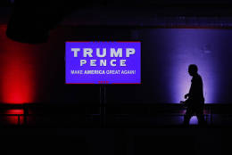 A television crew member walks along a balcony while setting up for Republican presidential candidate Donald Trump's election night rally, Tuesday, Nov. 8, 2016, in New York. (AP Photo/Julie Jacobson)