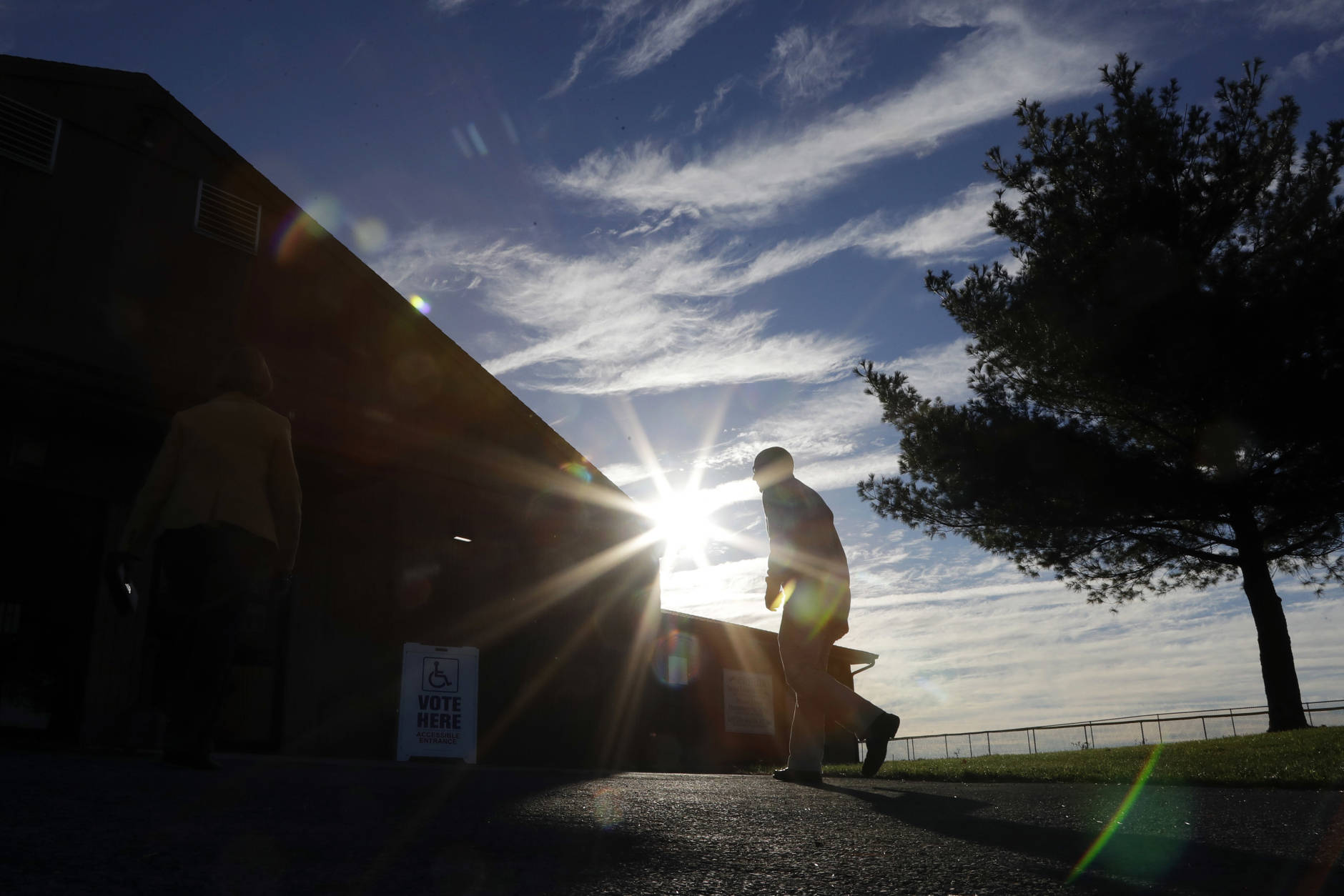 A voters walks to a polling place at the Schnecksville Fire Company, Tuesday, Nov. 8, 2016, in Schnecksville, Pa. (AP Photo/Matt Slocum)