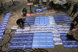 Workers make a large sign as they prepare for Pennsylvania Democratic Senate candidate Katie McGinty's election night party, Tuesday, Nov. 8, 2016, in Philadelphia. The most expensive political race in U.S. Senate history, Pennsylvania's contest between Sen. Pat Toomey, R-Pa. and Katie McGinty, could help decide control of the chamber. (AP Photo/Mel Evans)