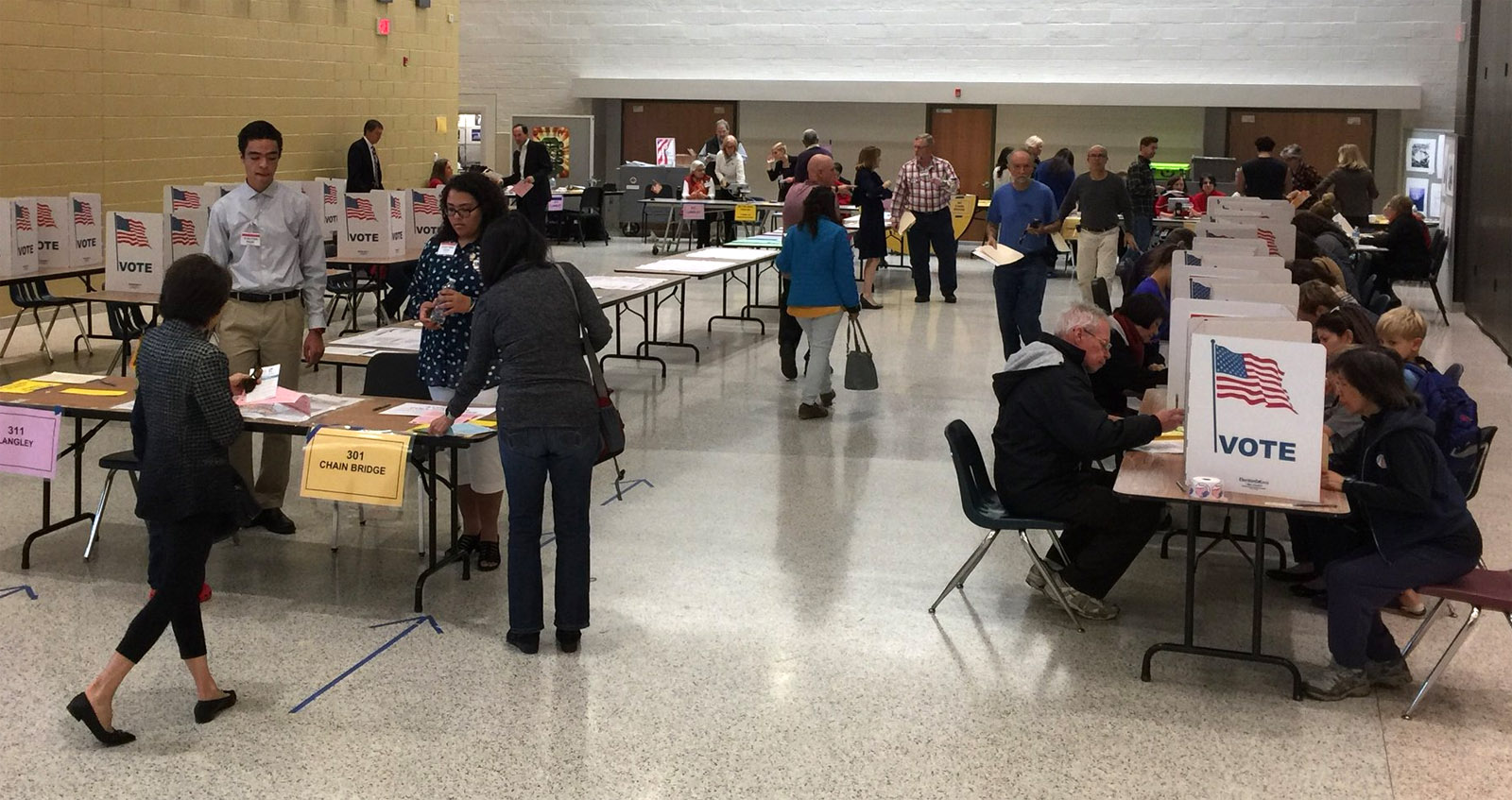 Voters cast their ballots at a Fairfax County polling site in Langley, Virginia on Tuesday, Nov. 8, 2016. Eighty percent of the county's registered voters had cast a ballot as of 6 p.m. (WTOP/Kristi King)