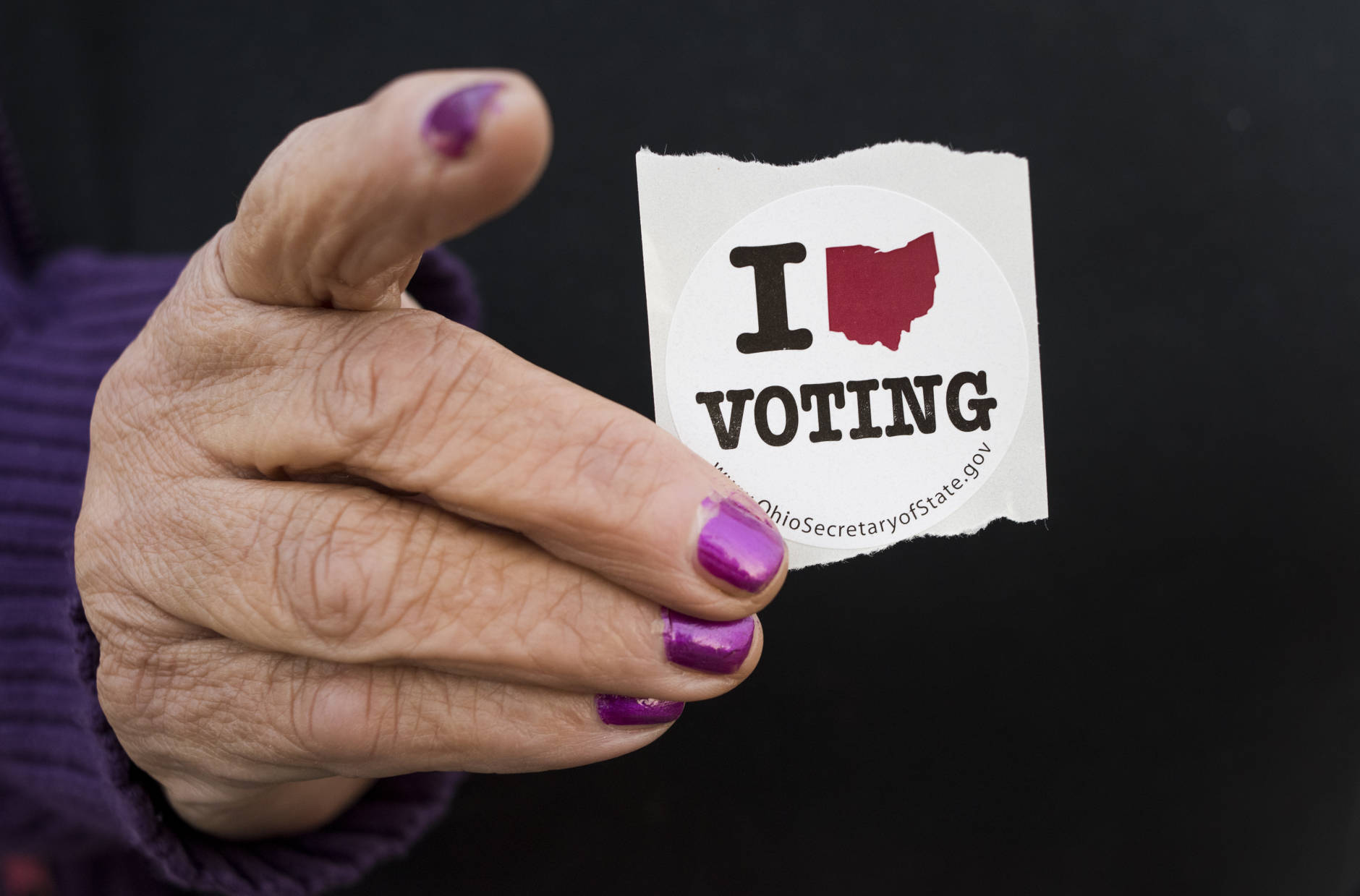 BUTLER TWP, OH - NOVEMBER 08: A woman holds her voting sticker in her hand after casting her ballot at the Leetonia American Legion Post 131 obn November 8, 2016 in Leetonia, Ohio. . This year, roughly 200 million Americans have registered to vote in this years general election between Republican presidential candidate Donald Trump and Democratic presidential candidate Hillary Clinton. (Photo by Ty Wright/Getty Images)