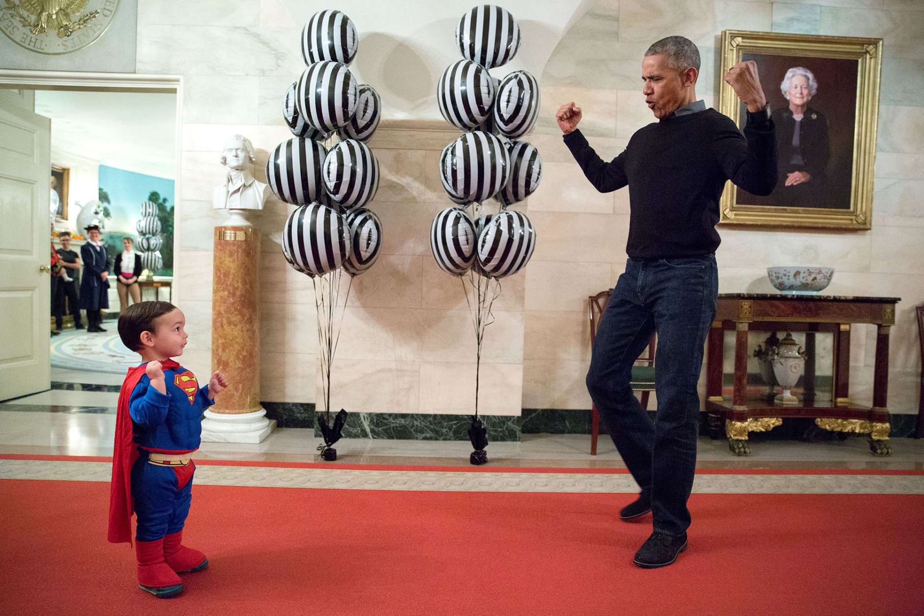 Oct. 31, 2016
“The President was about to welcome local children for Halloween trick-or-treating when he ran into Superman Walker Earnest, son of Press Secretary Josh Earnest, in the Ground Floor Corridor of the White House. ‘Flex those muscles,’ he said to Walker.” (Official White House Photo by Pete Souza)