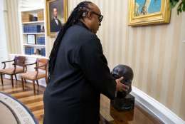 Aug. 5, 2016
“When Stevie Wonder stopped by for a visit, the President described many of the items in the Oval Office including the bust of Dr. Martin Luther King Jr.” (Official White House Photo by Pete Souza) This official White House photograph is being made available only for publication by news organizations and/or for personal use printing by the subject(s) of the photograph. The photograph may not be manipulated in any way and may not be used in commercial or political materials, advertisements, emails, products, promotions that in any way suggests approval or endorsement of the President, the First Family, or the White House.