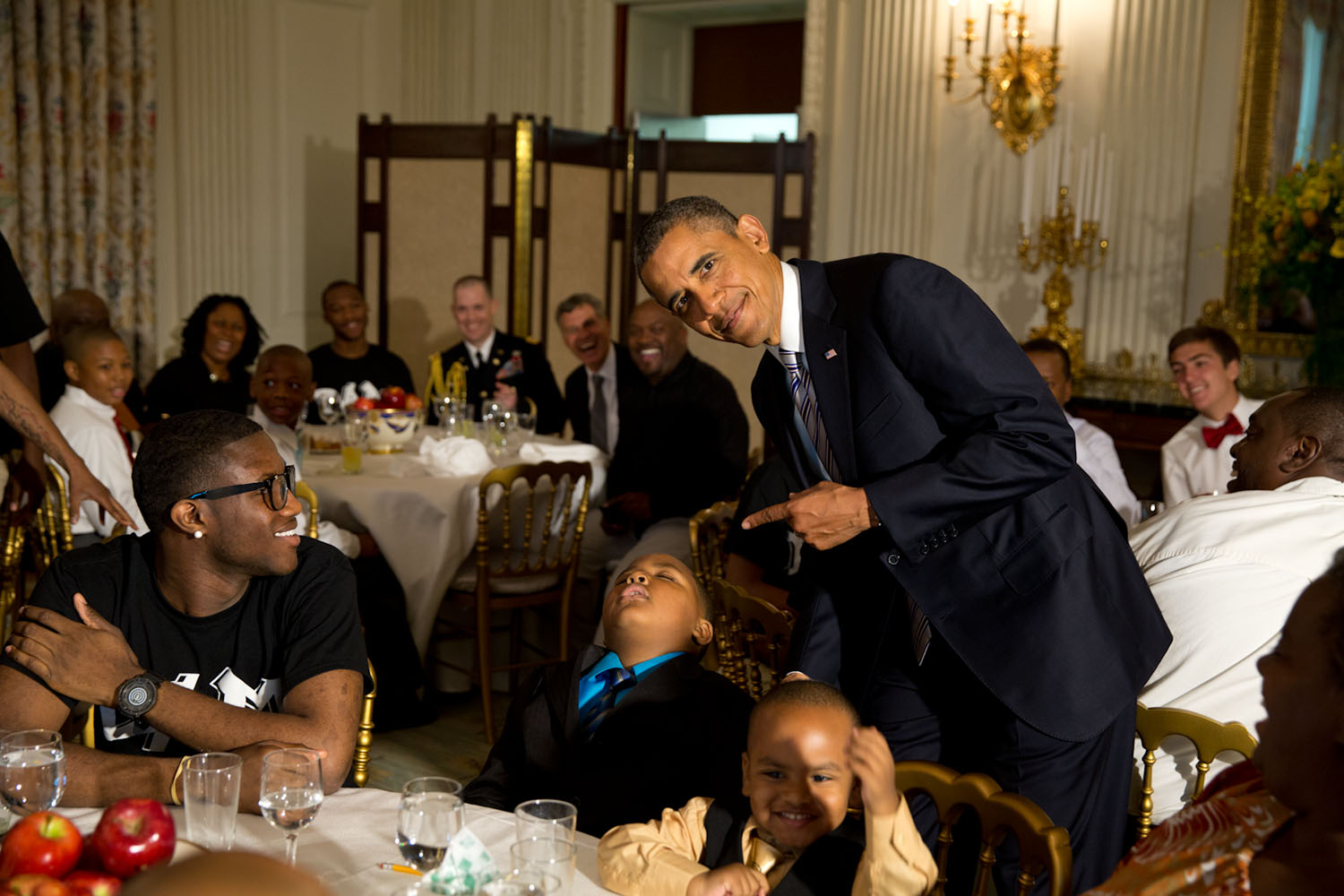 June 14, 2013
"The President called me over to pose for a photo with a young boy who had fallen asleep during the Father's Day ice cream social in the State Dining Room of the White House." 
(Official White House Photo by Pete Souza)

This official White House photograph is being made available only for publication by news organizations and/or for personal use printing by the subject(s) of the photograph. The photograph may not be manipulated in any way and may not be used in commercial or political materials, advertisements, emails, products, promotions that in any way suggests approval or endorsement of the President, the First Family, or the White House.