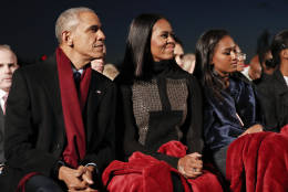 President Barack Obama, sits with first lady Michelle Obama, center, and their daughter Sasha, right, to watch the musical performances at the lighting the 2016 National Christmas Tree ceremony at the Ellipse near the White House in Washington, Thursday, Dec. 1, 2016. (AP Photo/Pablo Martinez Monsivais)