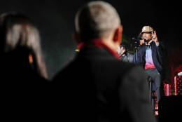 President Barack Obama, center, and first lady Michelle Obama, left, listen to Chancelor Bennett, "Chance the Rapper", right, from Chicago, perform at the lighting the 2016 National Christmas Tree ceremony at the Ellipse near the White House in Washington, Thursday, Dec. 1, 2016. (AP Photo/Pablo Martinez Monsivais)